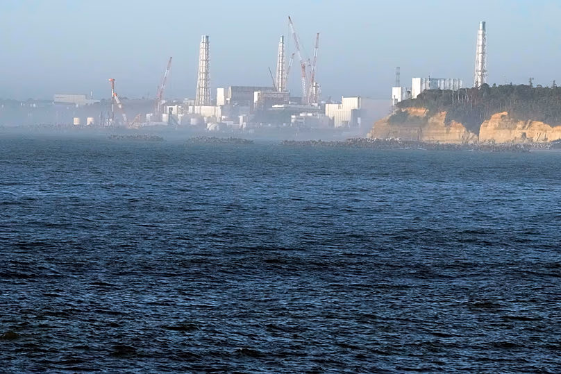 Fukushima Daiichi nuclear power plant, damaged by a massive earthquake and tsunami on 11 March 2011, seen from the fishing port of Ukedo in the city of Namie