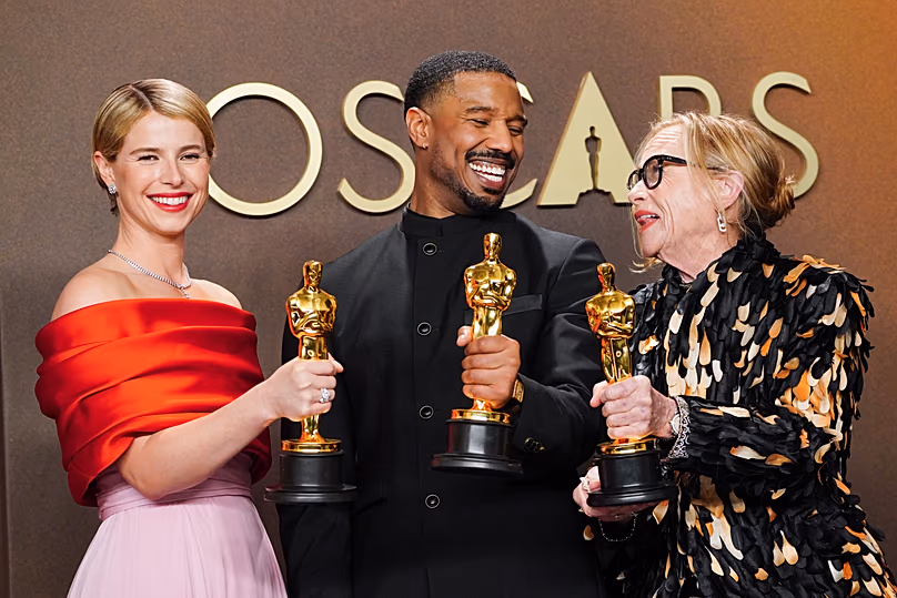 Jessie Buckley, Michael B. Jordan and Amy Madigan celebrating their wins
