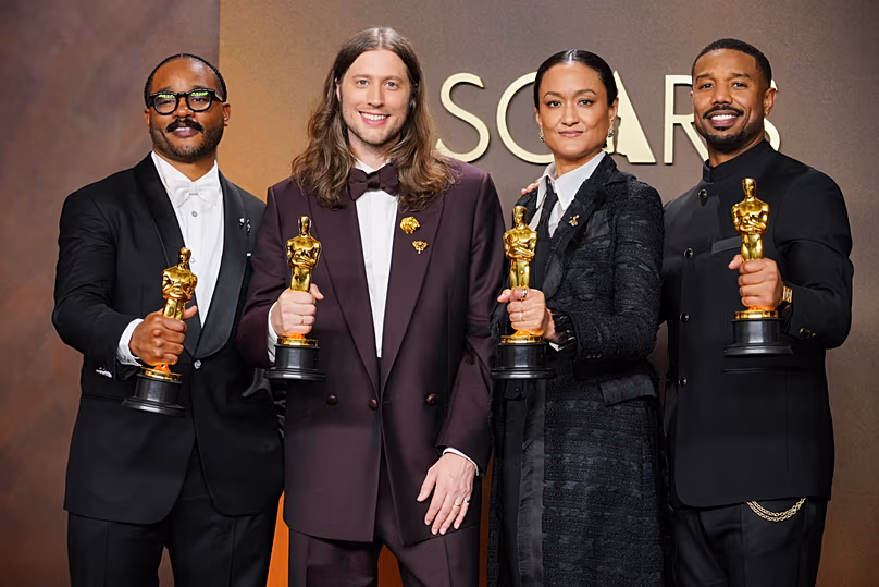 Ryan Coogler, Ludwig Goransson, Autumn Durald Arkapaw and Michael B. Jordan with the four Sinners Oscars