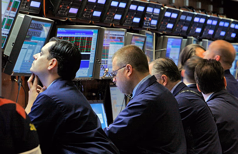 DÉPOSER. Les traders travaillent sur le parquet du NYSE, juin 2008