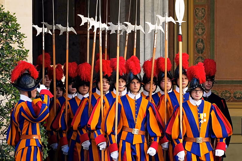 FILE: Pontificial Swiss Guards enter the St Damasus Courtyard at the Vatican ahead of the arrival of French President Emmanuel Macron, 10 April 2026