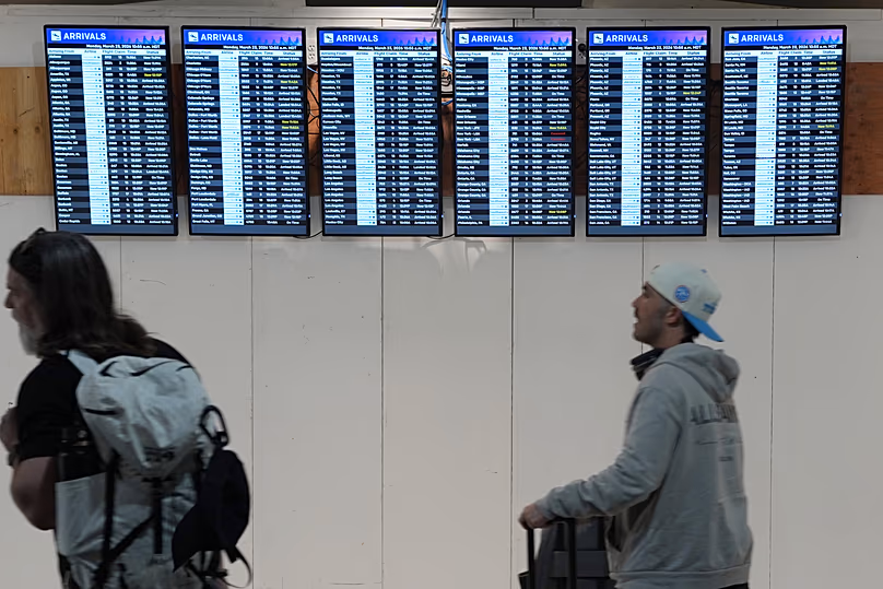 Voyageurs à l’aéroport international de Denver, le 23 mars 2026