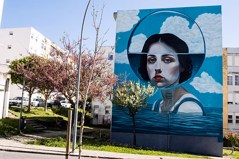 "Calipso", award‑winning street art mural by Patrícia Mariano