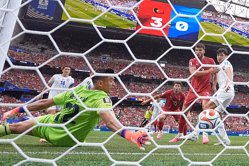 Uzbekistan goalkeeper Abduvohid Nematov scores an own goal during the World Cup Group K match against Portugal in Houston, Tuesday, June 23, 2026