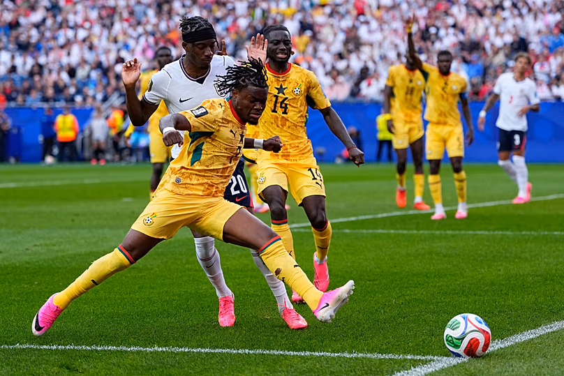 Ghana's Fatawu Issahaku and England's Noni Madueke battle for the ball during the World Cup Group L match in Foxborough, Massachussetts, near Boston, Tuesday, June 23, 2026