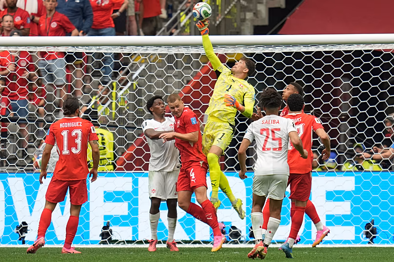 Switzerland goalkeeper Gregor Kobel jumps to make a save during the World Cup Group B match between against Canada in Vancouver, British Columbia, Wednesday, June 24, 2026