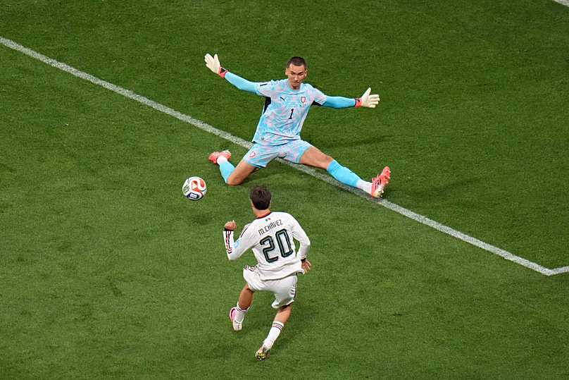 Mexico's Mateo Chavez scores their opening goal against Czechia goalkeeper Matej Kovar during the World Cup Group A match between in Mexico City, Wednesday, June 24, 2026