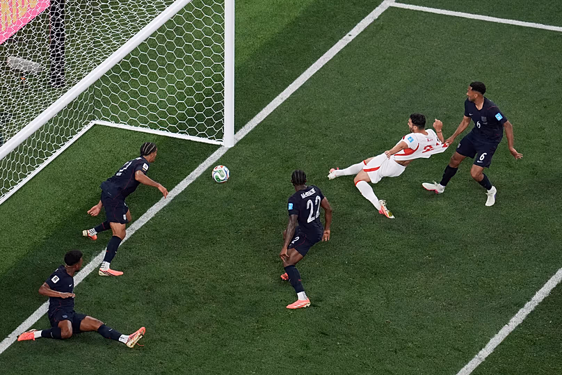 Turkey's Kaan Ayhan scores their third goal as US' Auston Trusty defends during the second half of a World Cup Group D match in Inglewood, California, Thursday, June 25, 2026