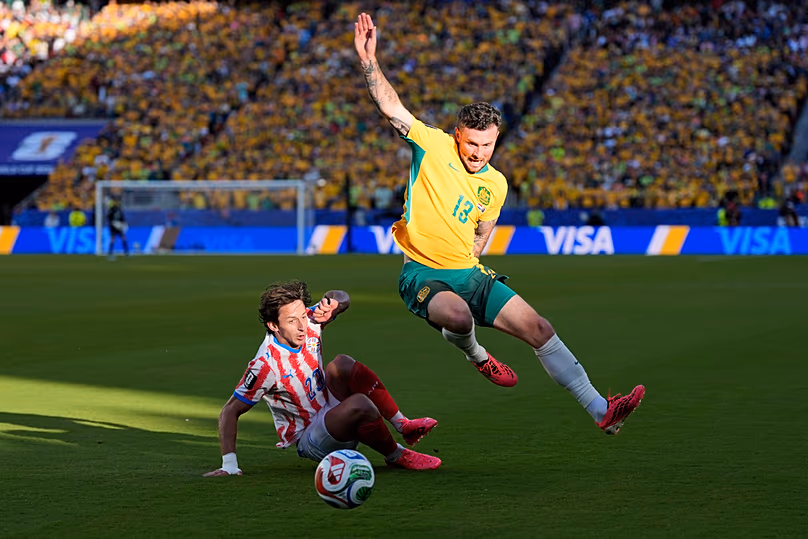 Australia's Aiden O'Neill battles for the ball with Paraguay's Matias Galarza during the World Cup Group D match in Santa Clara, California, Thursday, June 25, 2026