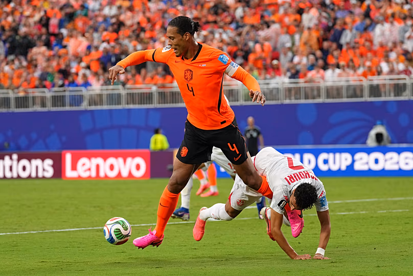 Netherlands' Virgil van Dijk vies for the ball with Tunisia's Elias Achouri during the World Cup Group F match in Kansas City, Mo, Thursday, June 25, 2026