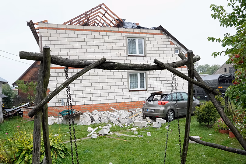 A damaged car and home due to fallen debris after Russian drones violated Polish airspace during an attack on Ukraine, in Wyryki near Lublin, Poland, 11 September, 2025.