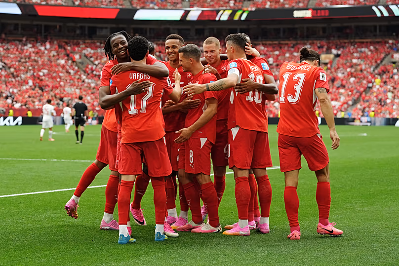 Switzerland's Ruben Vargas mobbed by teammates after scoring their first goal during the World Cup Group B match between against Canada in Vancouver, Wednesday, June 24, 2026