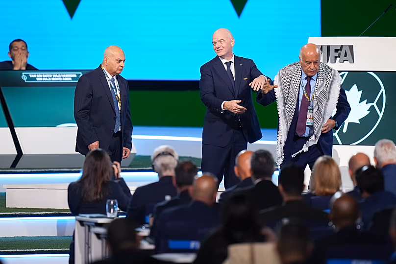 Palestinian Football Association President Jibril Rajoub walks away from Gianni Infantino - 30 April 2026