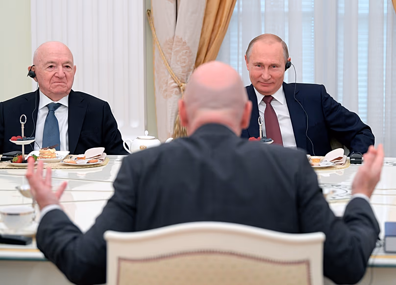 FILE: Vladimir Putin and First Vice President of the Russian Football Union Nikita Simonyan listen to Gianni Infantino - July 2018