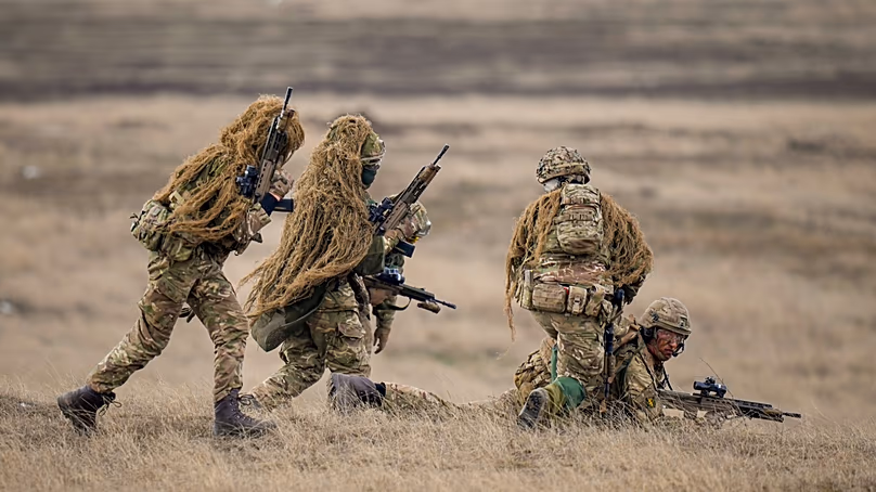 Militaires de l'OTAN sur un champ d'entraînement à Smardan, Roumanie, le 19 février 2025.