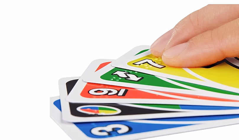 Close-up of UNO cards marked in braille for reading